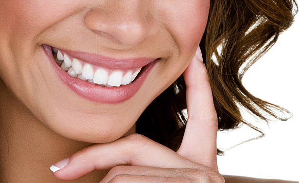 closeup of a woman smiling with white teeth