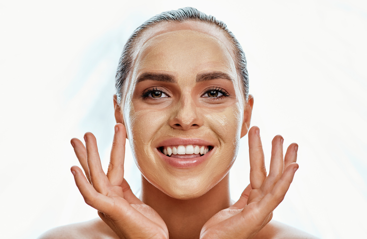 woman wearing a face mask against a white background
