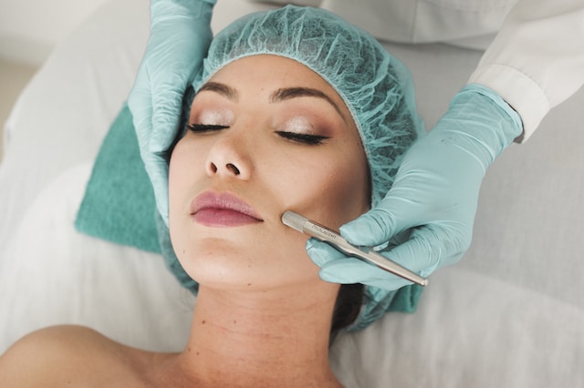 woman receiving facial care treatment
